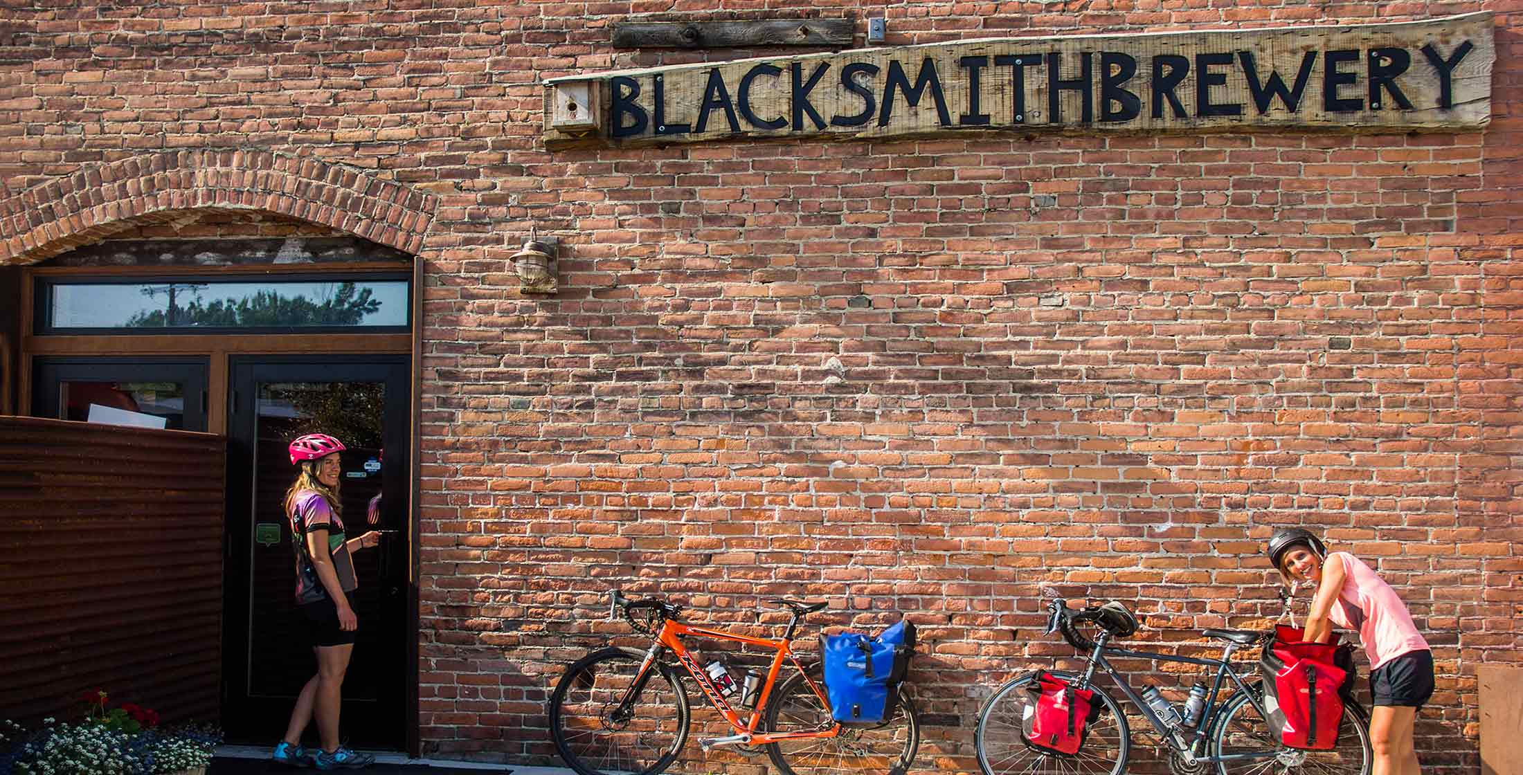 Bikers stop at Blacksmith Brewery on the Bitterroot Trail