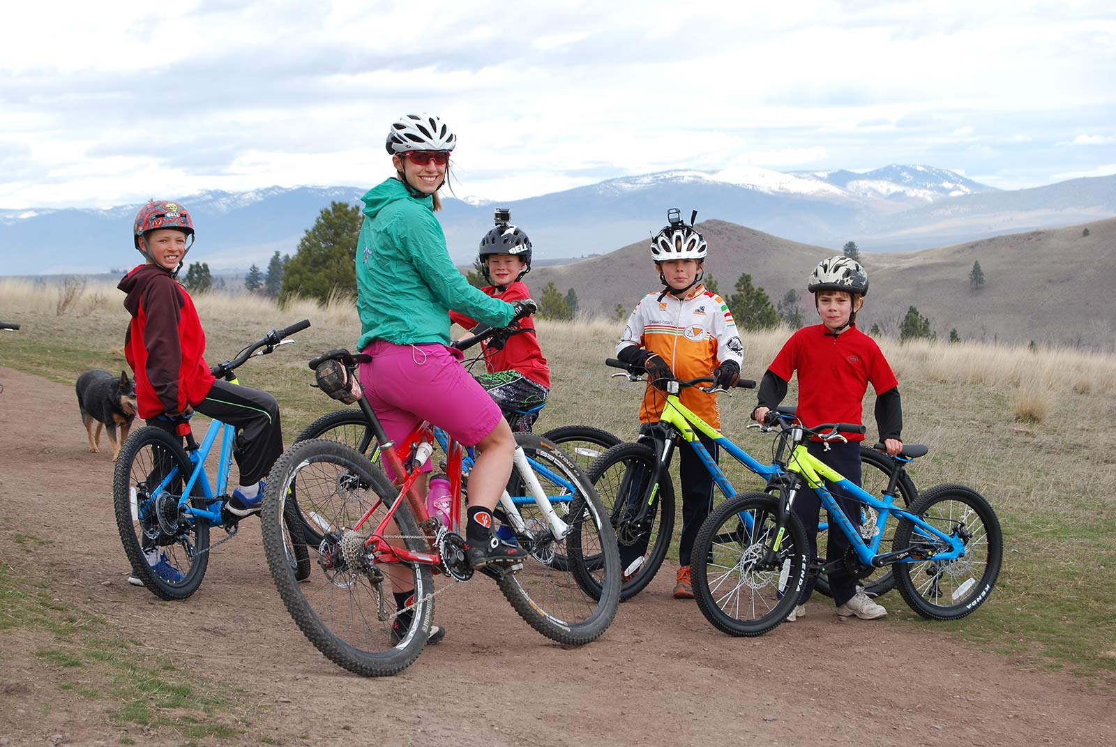 A family of cyclists take a break to pose for a picture on the Bitterroot Trail